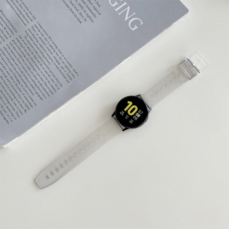 20mm light gray silicone watch strap with metal clasp, worn with a black smartwatch