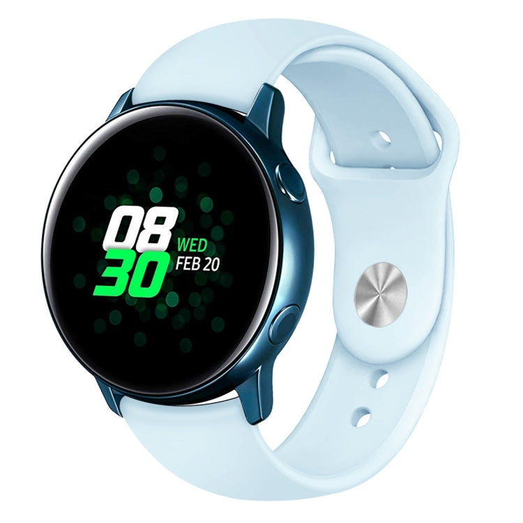 Light blue silicone smartwatch wrist strap with pin holes and metal keeper on watch