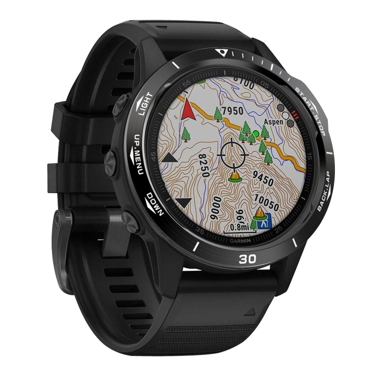 Black bezel ring with white text around smartwatch display on black watch