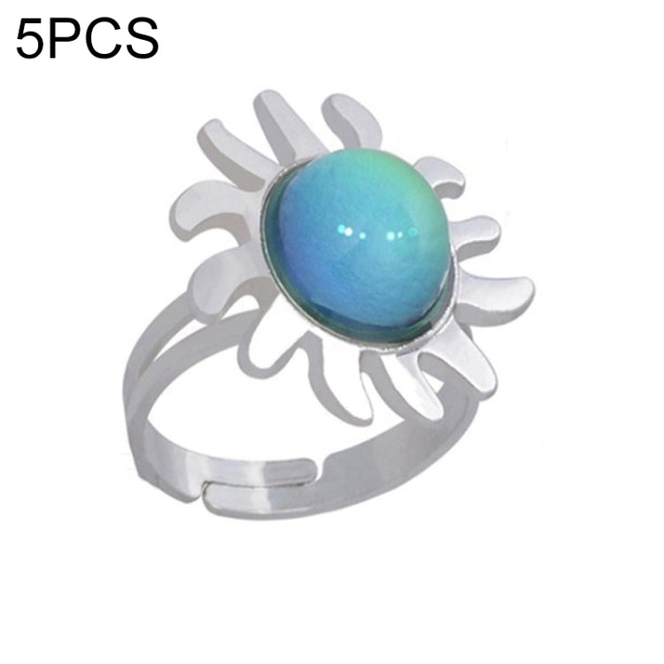 Adjustable open ring with blue color-change oval gem and sunburst charm