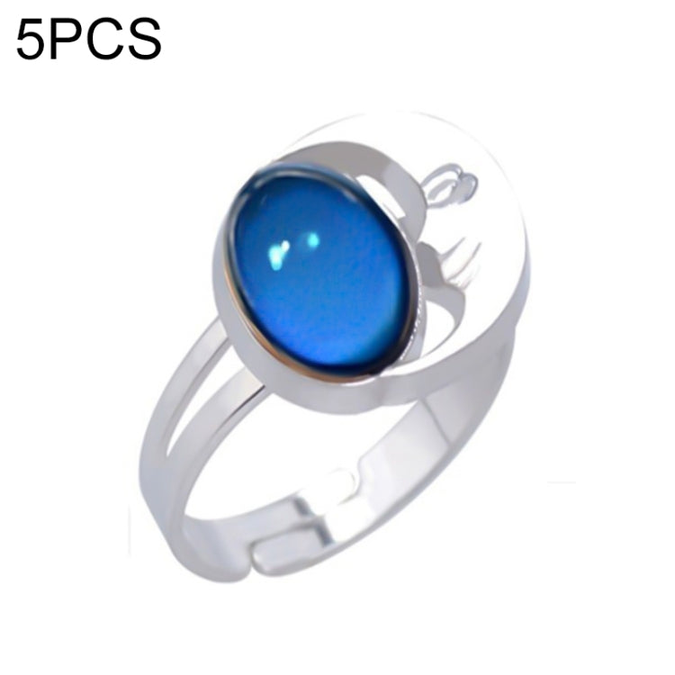 Adjustable open ring with bright blue oval color-change gem and wave charm