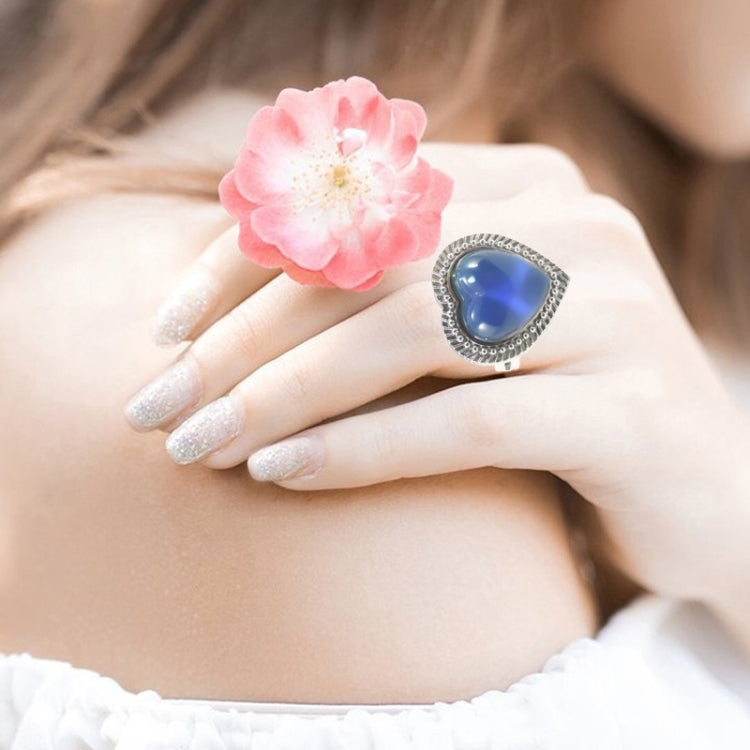 Adjustable open ring with blue heart gem in silver bezel