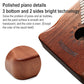 Wooden 17-tone kalimba close-up with metal tines and round sound hole
