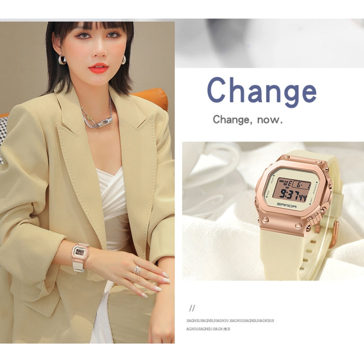 Rose-gold digital square-dial watch on wrist with black silicone strap