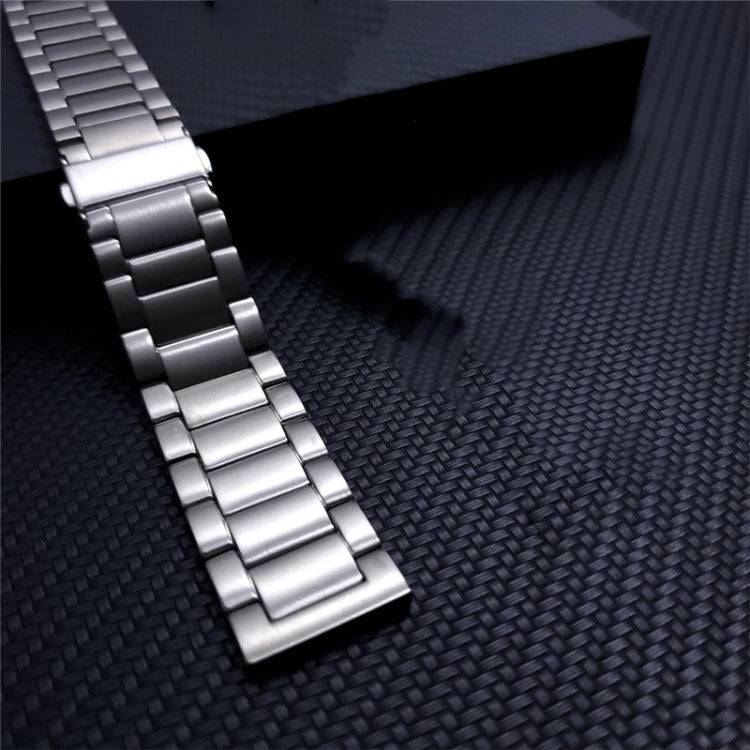 Silver metal watch band with flat buckle and stacked multi-row links