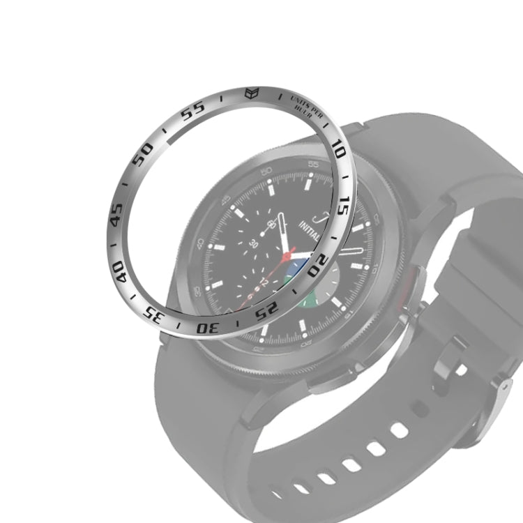 Smart watch steel bezel ring with silver outer numbers on a dark smartwatch case.