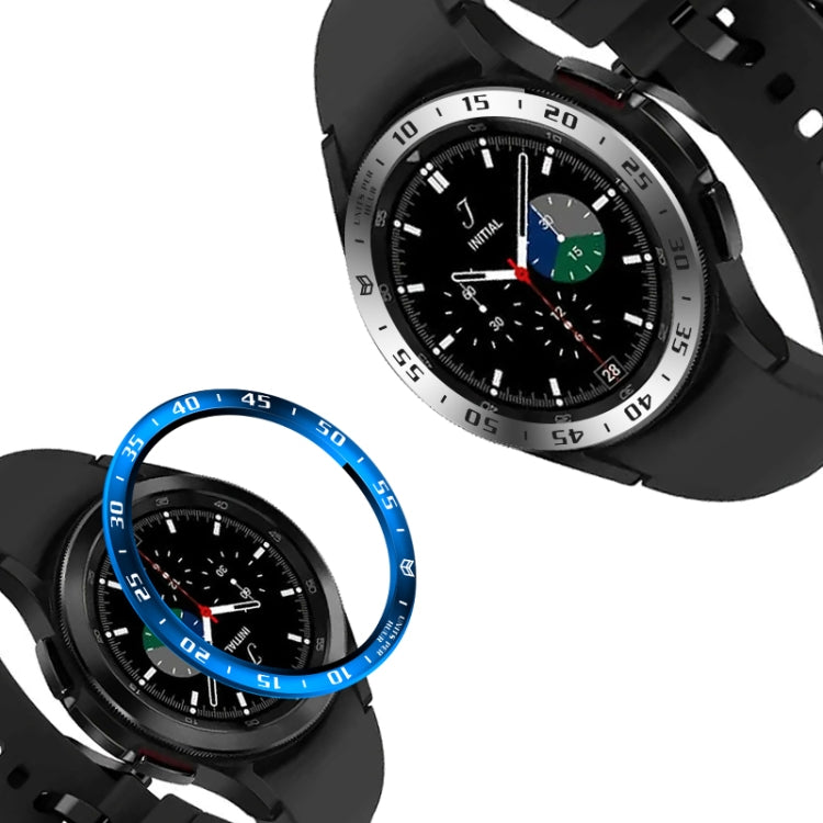 Smart watch steel bezel ring with blue outer numbers on a dark smartwatch case.
