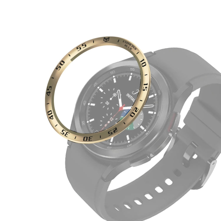 Gold-tone smartwatch bezel ring fitted around the watch face, engraved minute track