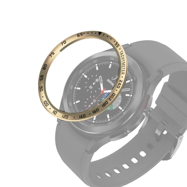 Smartwatch bezel ring attachment on black watch with gold bezel and dark chronograph dial