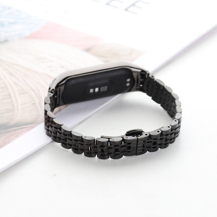 Black seven-bead stainless steel watchband with smartwatch side view
