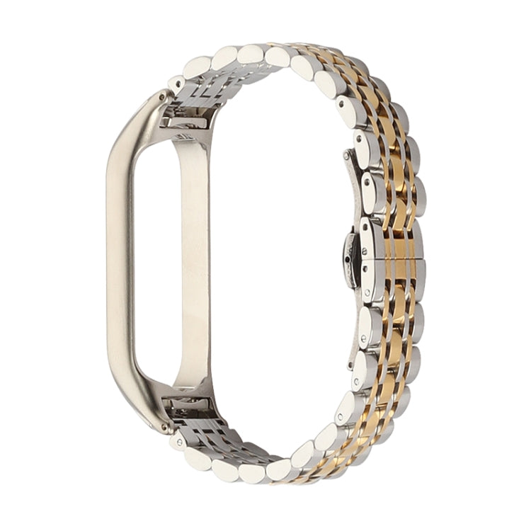 Seven-bead stainless steel watch strap, silver and gold two-tone link rows with clasp.