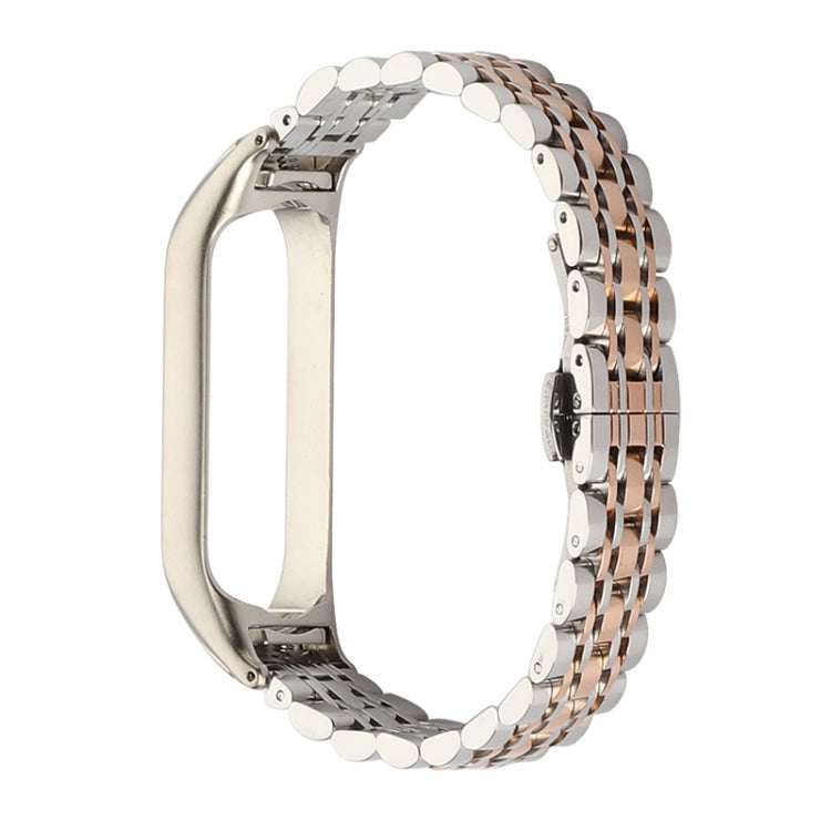 Seven-bead stainless steel watch strap, silver with rose-gold link rows and clasp.