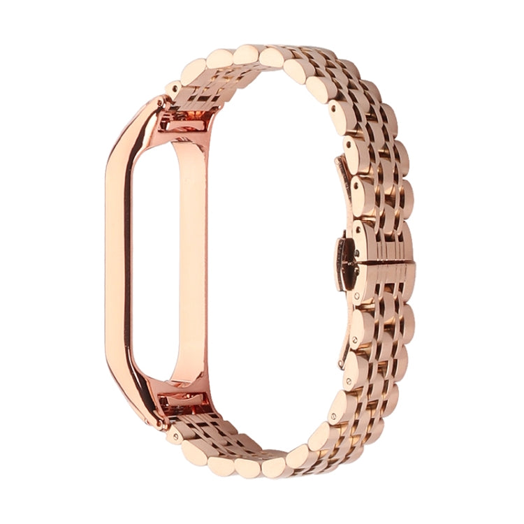 Seven-bead stainless steel watch strap, rose-gold link rows with clasp.