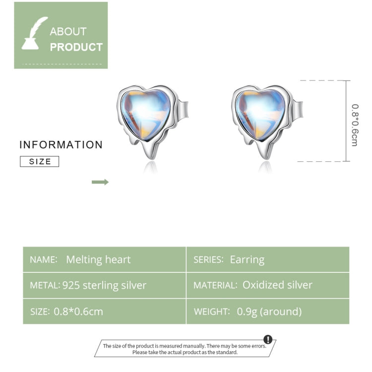 Heart-shaped moonstone stud earrings shown from front view with blue gem