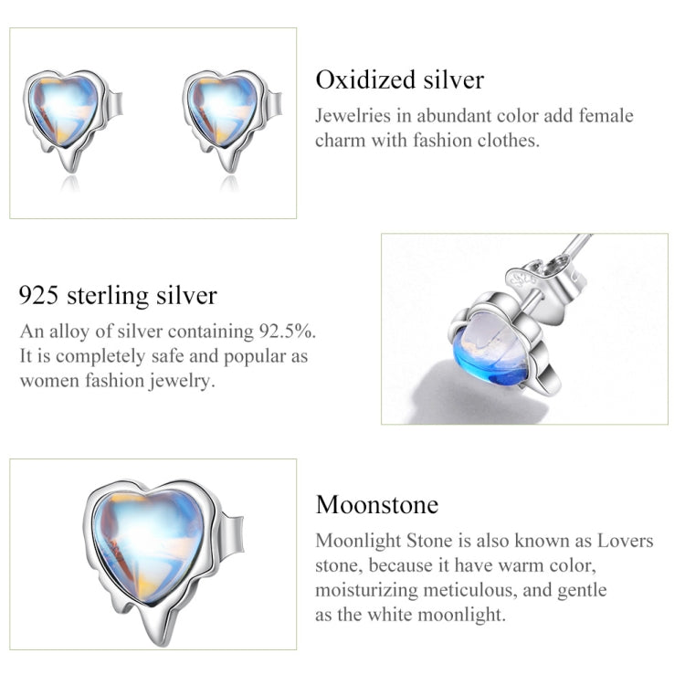 Oxidized sterling silver heart moonstone earrings with blue stone close-up