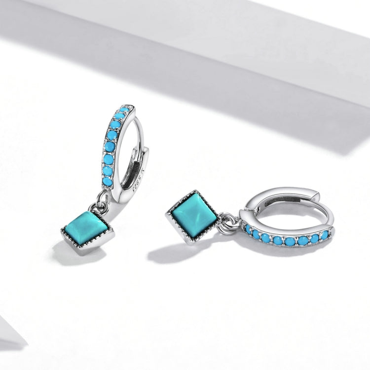 Turquoise square dangle hoop earrings with blue stone band and small silver ring charm