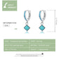 Turquoise ear buckle hoop earrings, sterling silver with blue stone band and drop charm