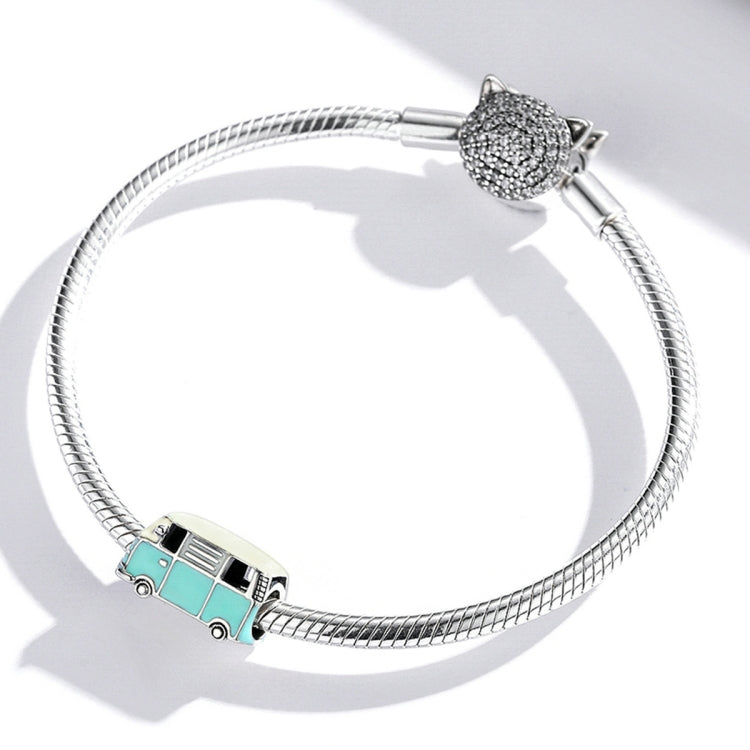 Silver charm bracelet with mini bus bead and cat-connector bead; mint and yellow enamel