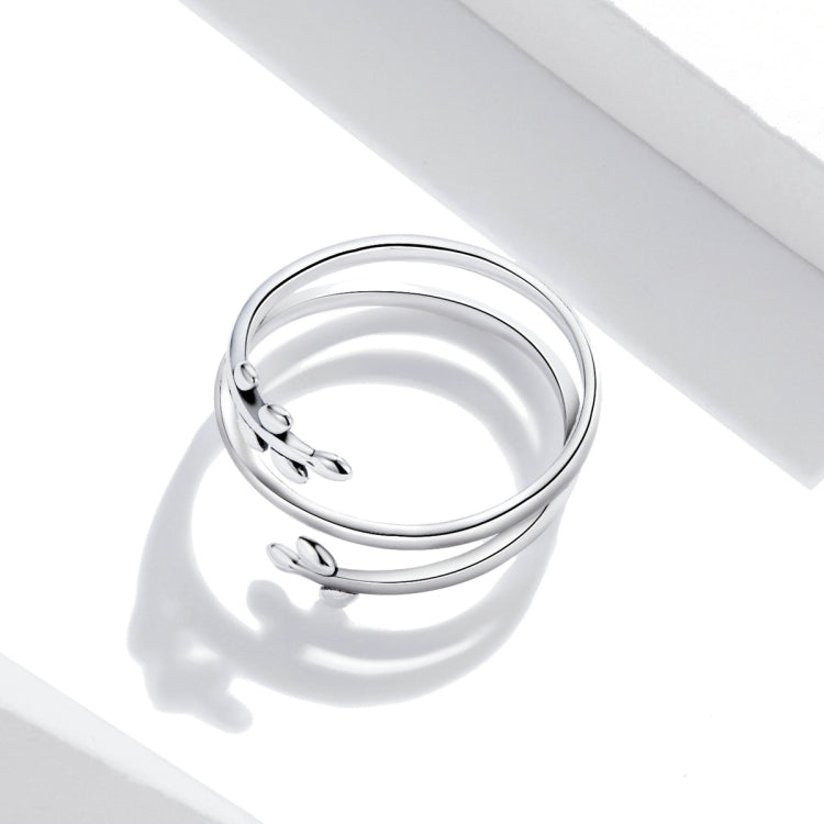 Sterling silver open multi-layer ring with leaf charm detail, side view