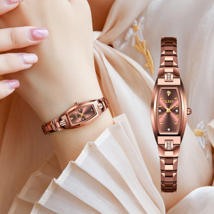 Rose gold tone women's quartz bracelet watch on wrist with diamond bezel and markers
