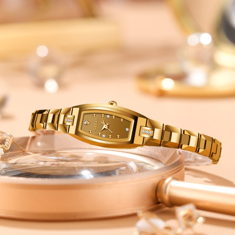 Gold tone women's quartz bracelet watch with rectangular bezel and gold link band