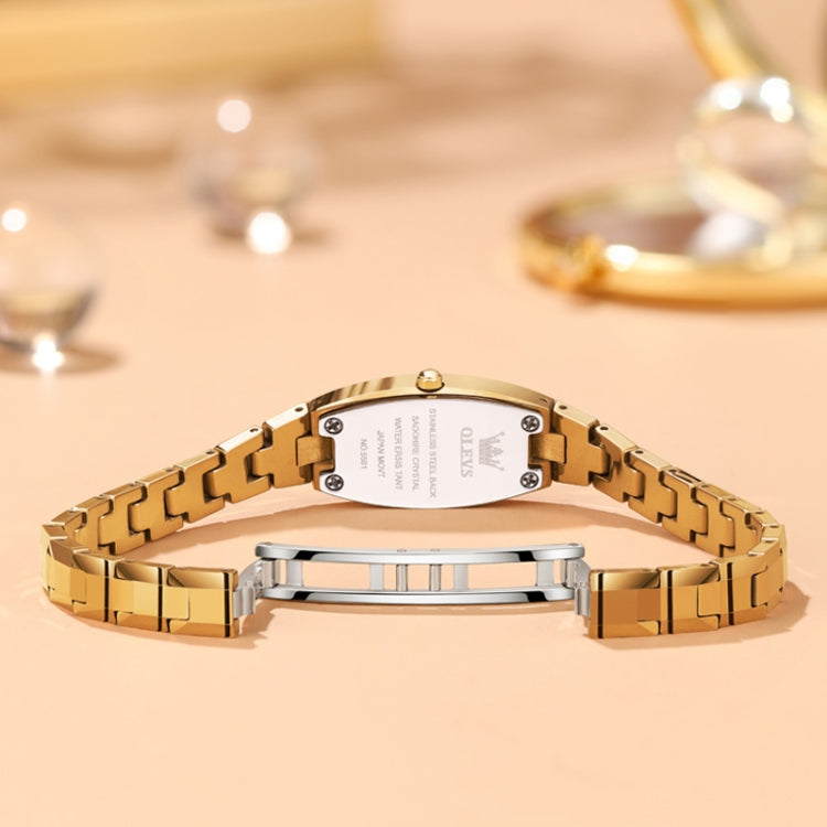Gold tone women's quartz watch bracelet with underside case and metal link clasp