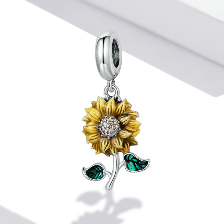 Hanging sunflower charm pendant with silver hoop, yellow flower and green enamel leaves
