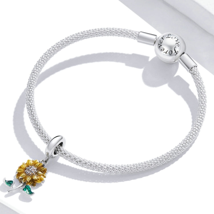 Silver mesh bracelet with sunflower charm, yellow flower and green enamel leaves