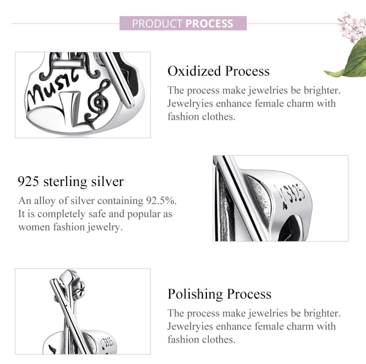 Sterling silver violin charm bead close-up with oxidized textured finish