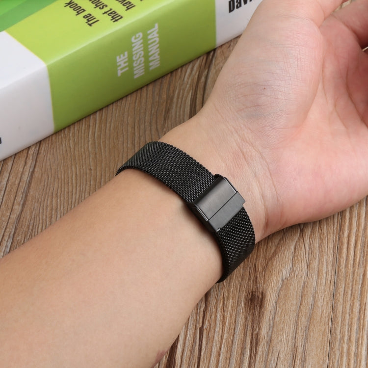 Double buckle Milanese mesh watch strap band on wrist, black metal weave with clasp