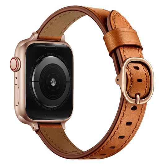 Brown leather Apple Watch strap with gold buckle and perforated holes