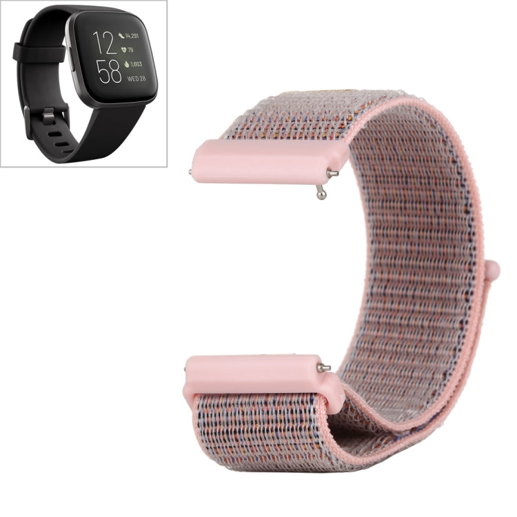 Pink nylon watch band with hook-and-loop closure and light pink snap connectors