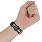 Two-color silicone watch band on wrist, black strap with white dotted vent holes