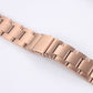 Rose gold three-bead steel watchband detail, clasp hardware and connector links
