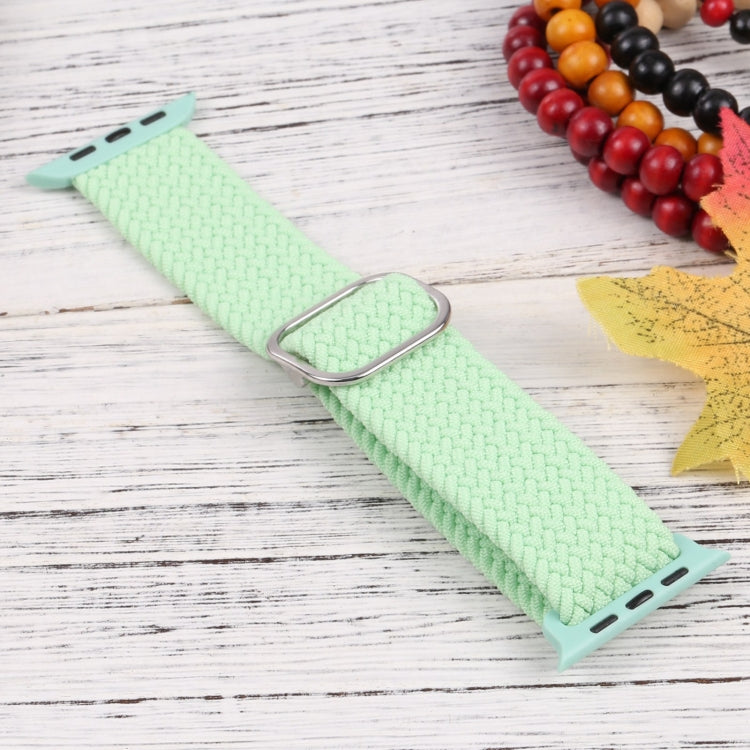 Mint green nylon braid watchband with metal clasp and perforated ends