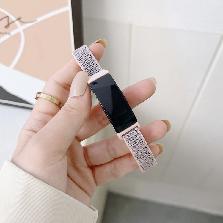 Light purple nylon loop watchband with black clasp, worn on wrist