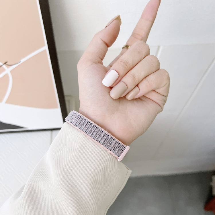 Light purple nylon loop watchband with black clasp on wrist