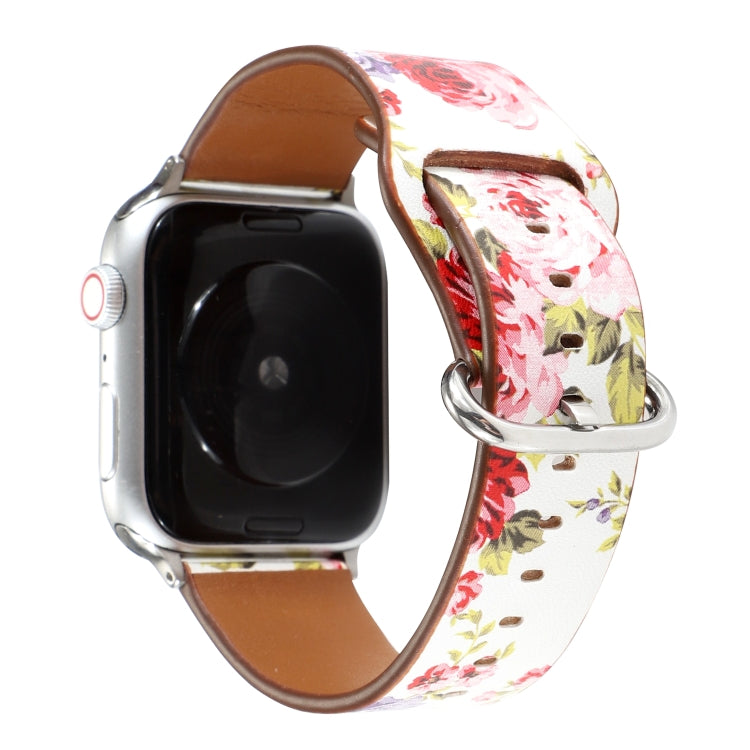 Floral watch strap with white pink flower pattern, brown leather back, silver metal clasp.