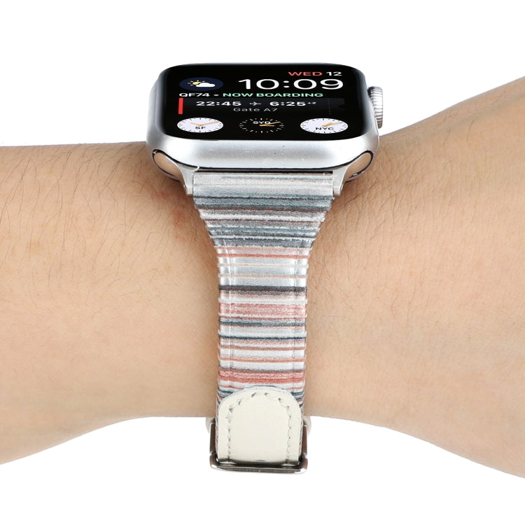 White genuine leather watch band with striped fabric underside and buckle on wrist