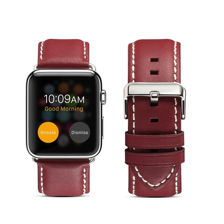 Genuine leather watchband in red-brown with stitched edges and metal buckle clasp