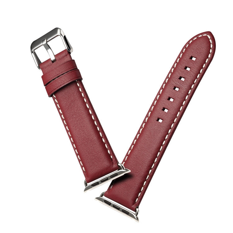 Red-brown leather watch strap with metal buckle and white contrast stitching across links