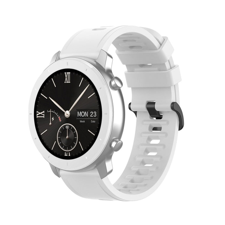 White silicone smartwatch replacement strap with perforated holes and quick-release lugs