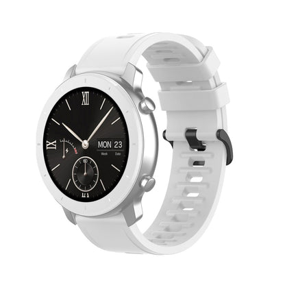 White silicone smartwatch replacement strap with perforated holes and quick-release lugs