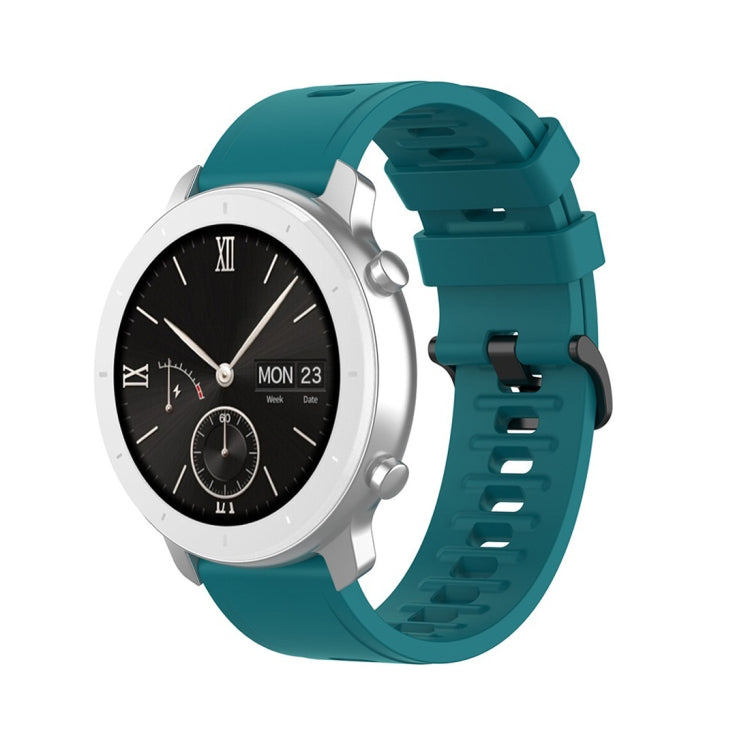 Dark teal silicone smartwatch replacement strap with perforated holes and secure clasp