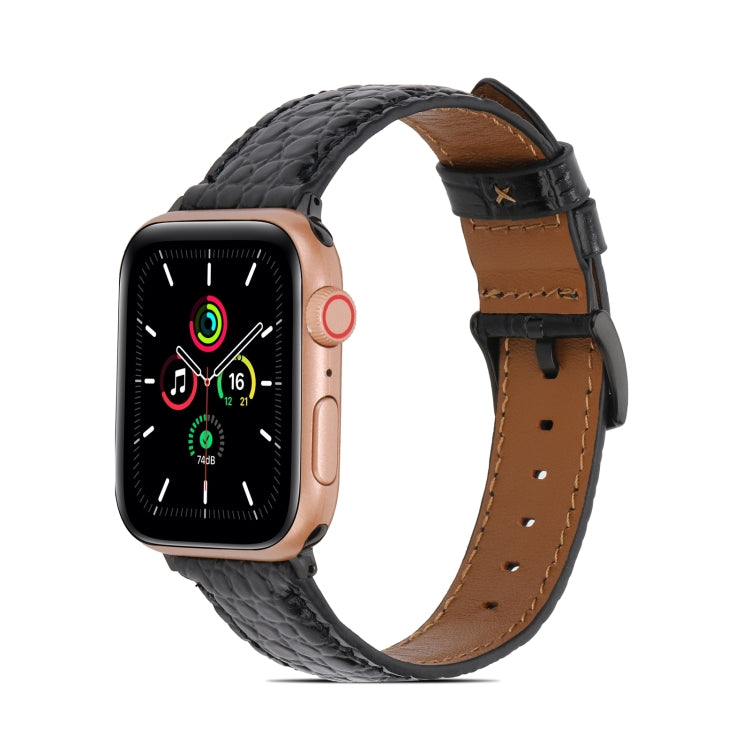Crocodile-texture leather watch band, black with tan underside and stitched holes.