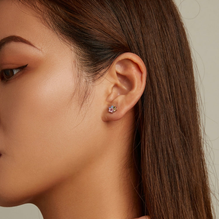 Small zircon cluster ear stud with pink center and sparkle stones in silver-tone setting
