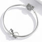 Sterling silver charm bracelet with infinity flower beads and cat head charm