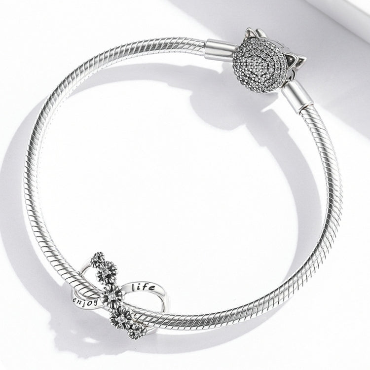Sterling silver charm bracelet with infinity flower beads and cat head charm