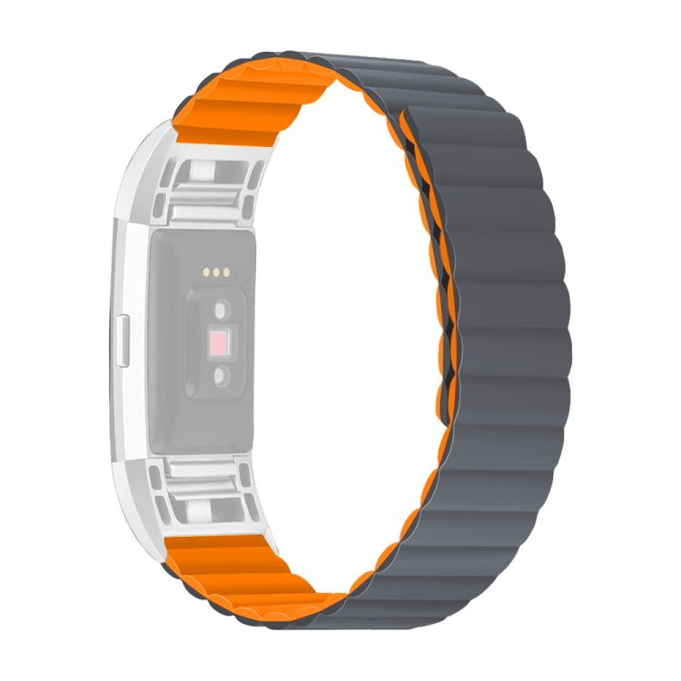 Silicone watch band with dark gray links and orange edge accents