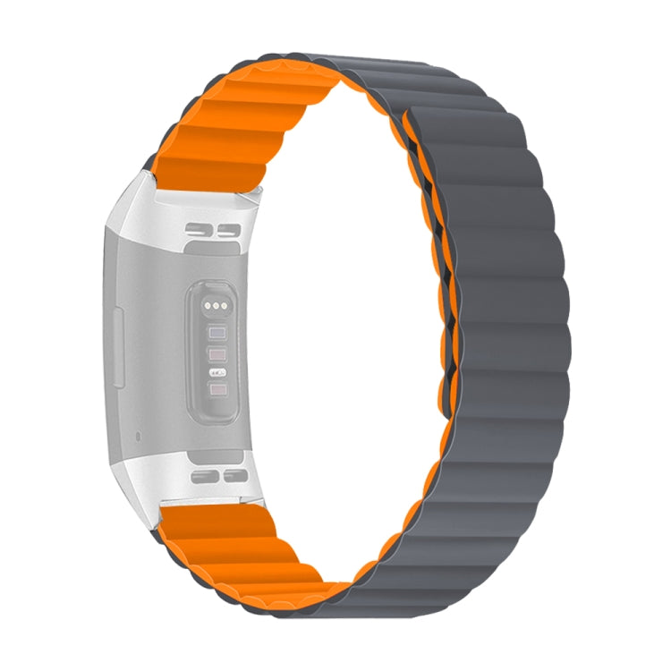 Silicone watch band with gray links and bright orange edge accents